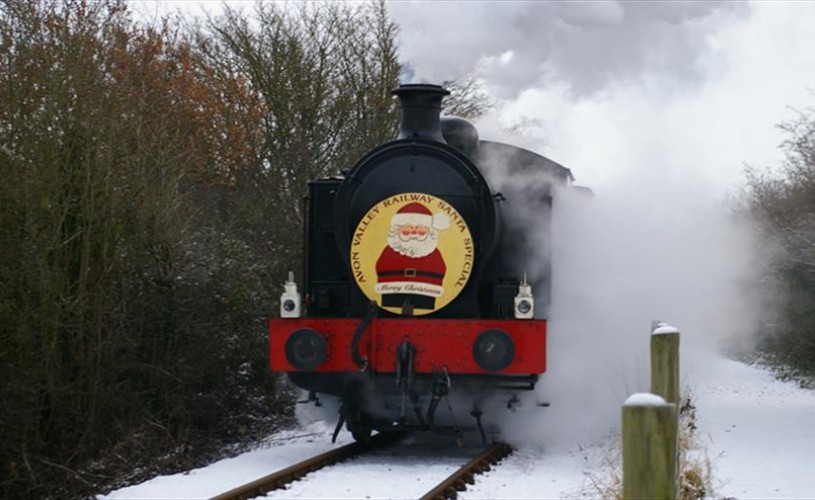 Train with Santa sign on the front surrounded by snow
